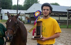 Boy with horse and trophy