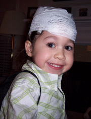 Child with her head bandaged