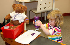 Girl Holding Paint Bottle