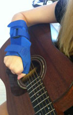 Arm with Brace Playing Guitar