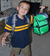 Boy Holding Up Lunchbox