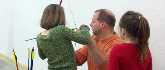 Girls Learning Archery