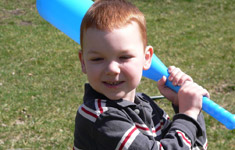 Young child with a plastic bat
