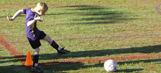 Child playing soccer