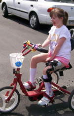 Girl in a brace riding her bike